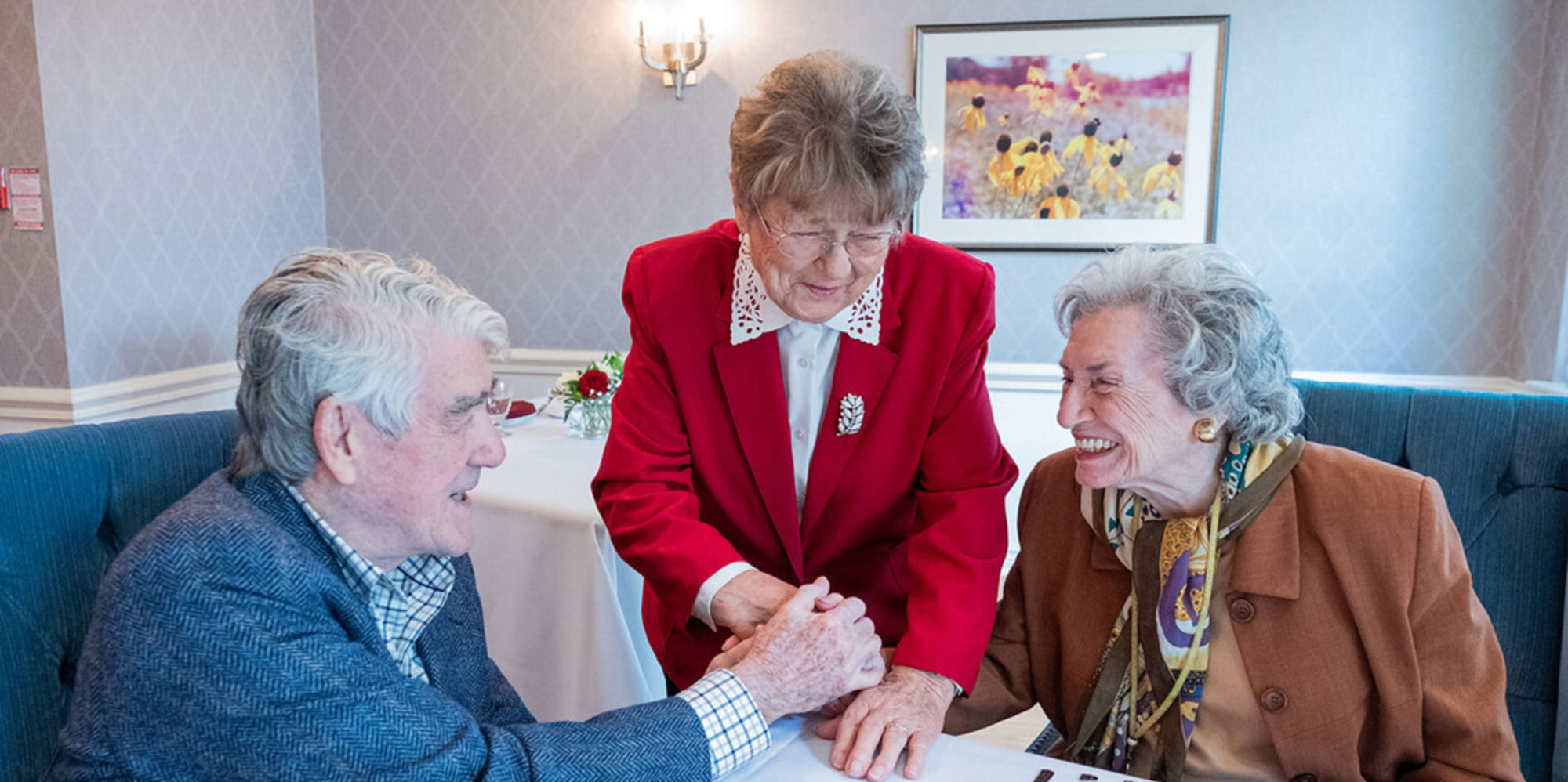 Three Willoughby Manor residents smiling